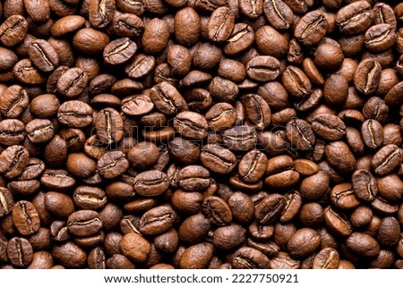 Roasted coffee beans top view, closeup image, space for text