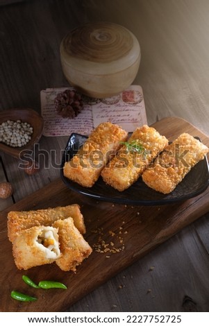Rissole or risoles is a small patty enclosed in pastry , or rolled in breadcrumbs