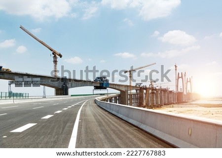 Construction of bridge under blue sky. Royalty-Free Stock Photo #2227767883