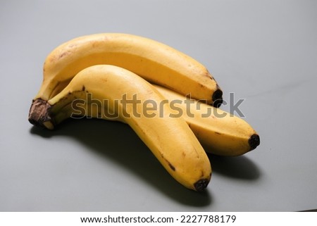 Yellow banana on background. Name latin banana is musa. Pisang