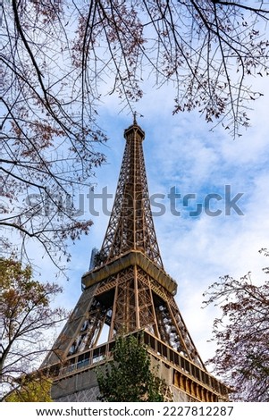 Part of Eiffel Tower with classic tone color background, a wrought-iron lattice tower on the Champ de Mars in Paris, France. Locally nickname is "La dame de fer"