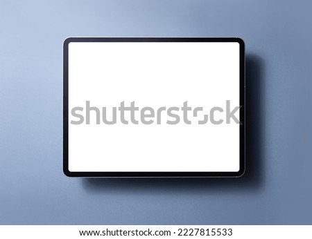 Tablet computer with blank screen isolated on color background Royalty-Free Stock Photo #2227815533