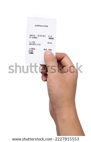 Hand holding a receipt isolated on white background Royalty-Free Stock Photo #2227815553