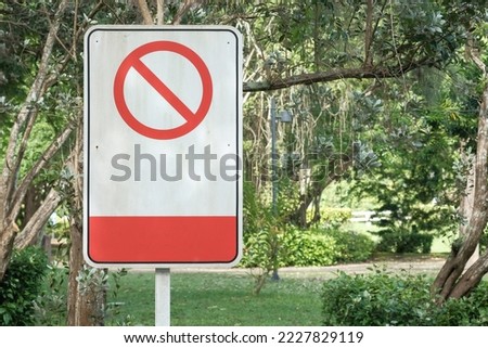 Warning or prohibited transportation sign in the public park area with text copy space. Park regulations template concept.