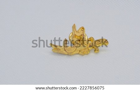 Islamic themed collar badge on a white background.