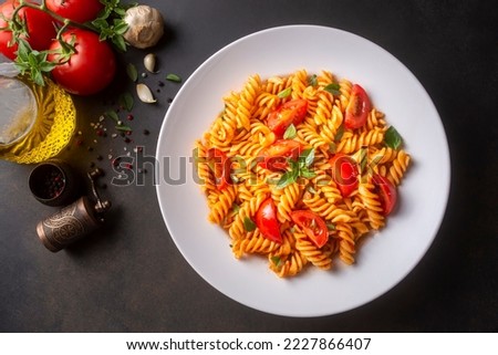 Fusilli pasta, spiral or spirali pasta with tomato sauce  - Italian food style Royalty-Free Stock Photo #2227866407