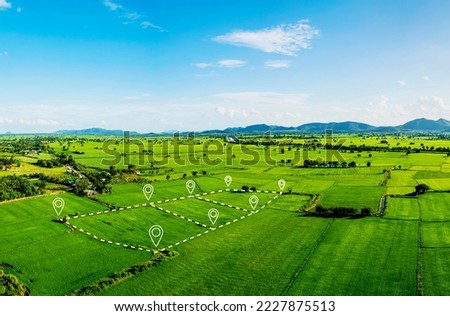 Land plot in aerial view. Include landscape, real estate, green field, crop, agricultural plant.Tract of land for housing subdivision. Aerial view of land and positioning point area. Royalty-Free Stock Photo #2227875513