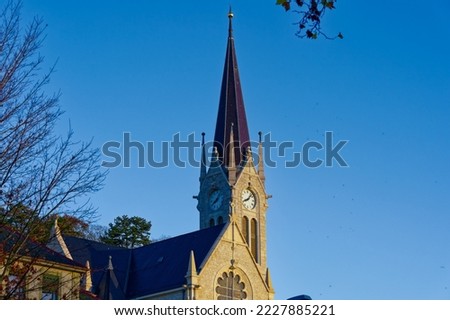 Catholic church in bright sunlight at Swiss City of Biel Bienne on a sunny autumn day. Photo taken November 10th, 2022, Biel Bienne, Switzerland.
