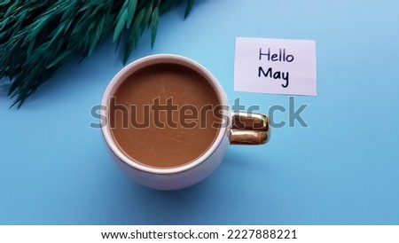 Text hello may, coffee on a blue background.