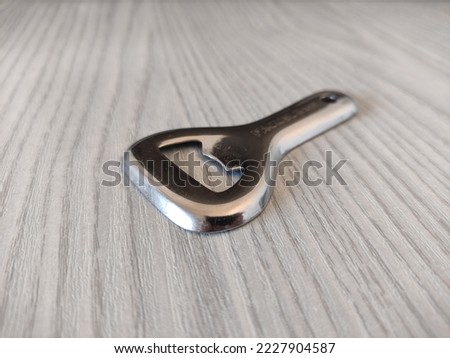 Metal bottle opener on a table