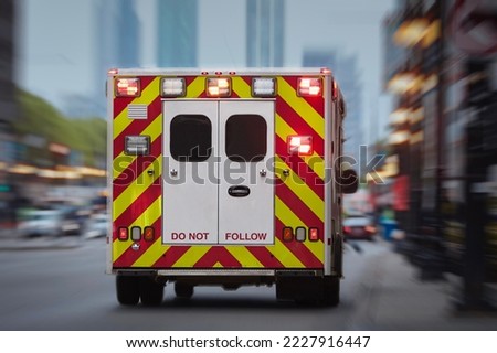 Ambulance car of emergency medical service on urban street. Themes rescue, urgency and health care.
 Royalty-Free Stock Photo #2227916447