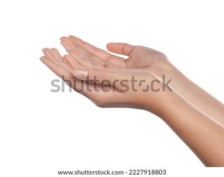 Woman holding her hands against white background, closeup