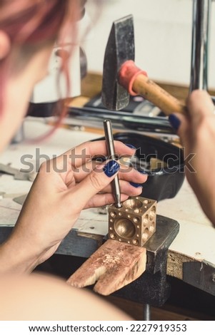 Close up jeweller workplace concept photo. Dapping set for metal. Rear view photography with instruments on background. High quality picture for wallpaper, travel blog, magazine, article