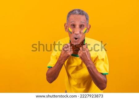 Brazilian black man, soccer fan from Brazil. celebrating, celebrating. elderly man Brazilian fan.