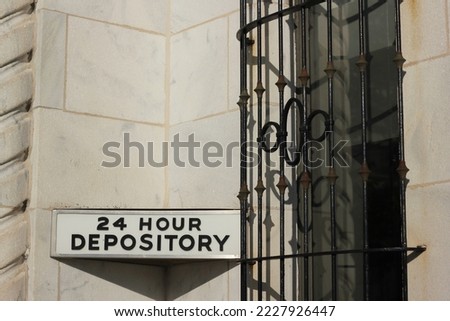 Vintage traditional 24 hour bank depository window. Royalty-Free Stock Photo #2227926447
