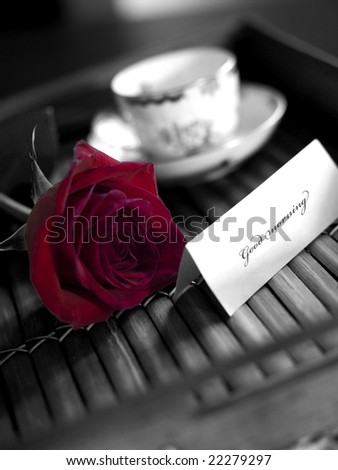 red rose with coffee and greetings card