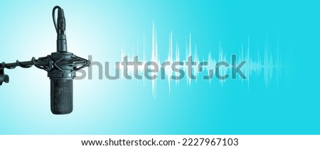 Studio vocal microphone with audio waveform on blue background. Podcast or music production banner with copy space for audio content creator