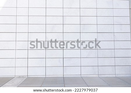 White wall with rectangular tiles