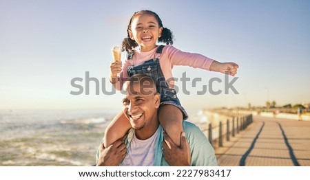 Family, children and piggyback with a father and daughter eating ice cream while walking on the promenade together. Sky, nature and kids with a man and girl bonding with the sea or ocean at the beach Royalty-Free Stock Photo #2227983417