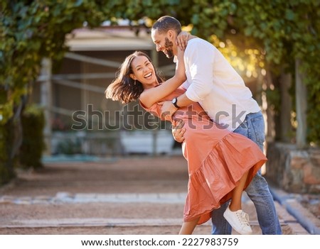 Happy couple, dance and love in park, garden and sunshine for bonding, quality time and romantic date together. Smile, dancing and fun man, woman and partner, freedom and happiness outdoors in summer Royalty-Free Stock Photo #2227983759