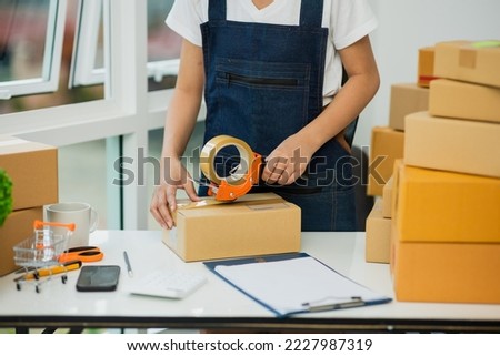 Close-up photo of female entrepreneurs Small business SME freelance, young woman portrait working at home, BOX, smartphone, laptop, online, marketing, packaging, delivery, b2b, SME, ecommerce concept.