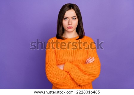 Photo portrait of nice young lady crossed arms offended angry upset wear trendy knitwear orange look isolated on violet color background Royalty-Free Stock Photo #2228016485