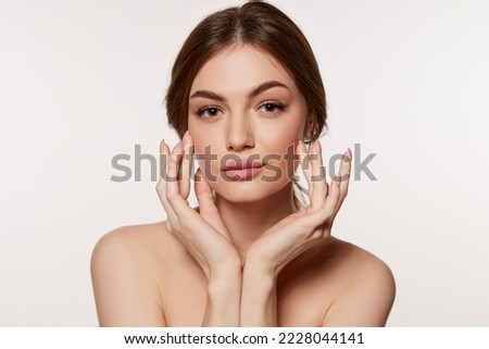 Portrait of young beautiful woman with perfect smooth skin isolated on white background. Taking care after skin condition. Concept of natural beauty, plastic surgery, cosmetology, cosmetics, skin care Royalty-Free Stock Photo #2228044141