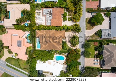 Aerial image of a residential neighborhood with yachts, boats and the sea in Miami Beach, Florida.