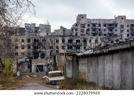 destroyed and burned houses in the city during the war in Ukraine Royalty-Free Stock Photo #2228079969