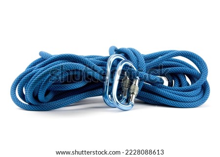 Isolated new climbing equipment - carabiners without scratches and blue rope Royalty-Free Stock Photo #2228088613