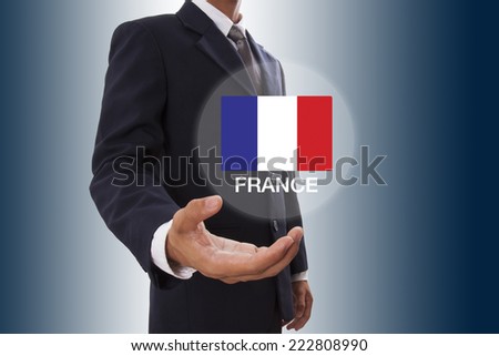 Businessman hand showing France flag 