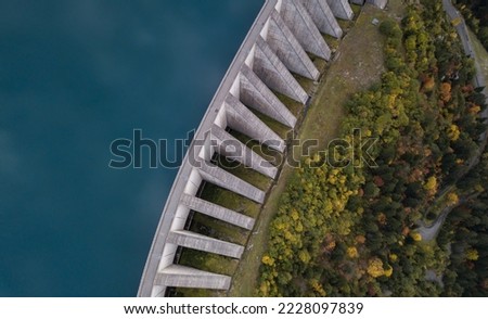 water dam from above, environment friendly electricity generation Royalty-Free Stock Photo #2228097839