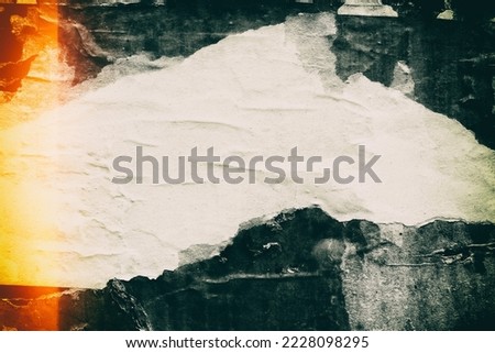 Old ripped torn grunge posters and backgrounds creased crumpled paper backdrop surface placard empty space for text Royalty-Free Stock Photo #2228098295