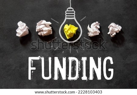 Funding Word Written In Wooden Cube Royalty-Free Stock Photo #2228103403