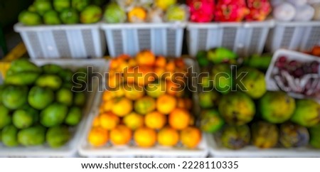Blurred portrait of fruits in fruit shop. Suitable to be used as a background