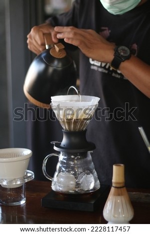 Barista brewing coffee, method pour over, drip coffee Royalty-Free Stock Photo #2228117457