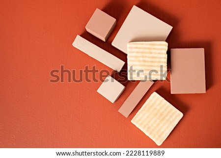 over head shot of product photography of handmade artisan soaps, set with orange and light brown colors. Royalty-Free Stock Photo #2228119889