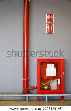 Building Emergency Exit with Exit Sign and Fire Extinguisher,fire protection concept
