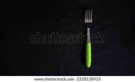 Fork on a black background. Best photo of fork on black background isolated. Isolated fork object suitable for fork related content illustration, or for food related content. Isolated photo.