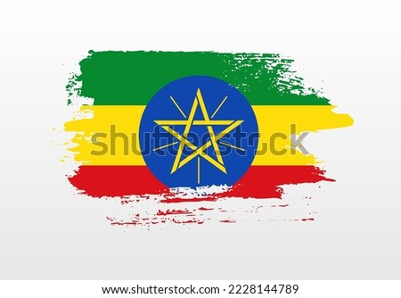 Modern style brush painted splash flag of Ethiopia with solid background
