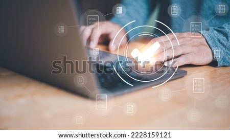 Businessmen reviewing procedures through virtual online documents, concepts on practices and policies. Articles of Association terms and conditions, check mark icon Indicates the validity of agreement Royalty-Free Stock Photo #2228159121
