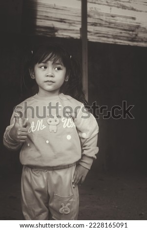 beautiful little asian girl, black and white photo