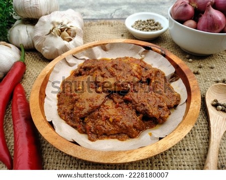Rendang jengkol, spicy jengkol balado or jengkol stew, made from jengkol seeds or dogfruit with Indonesian spices and coconut milk, one of the popular dishes from Indonesia