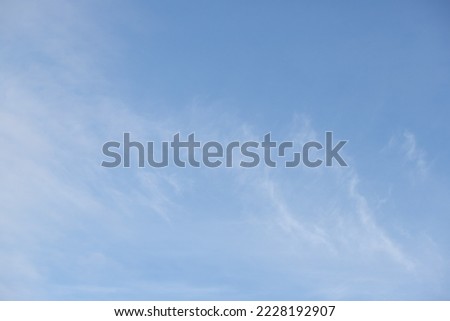 blue sky background small white clouds