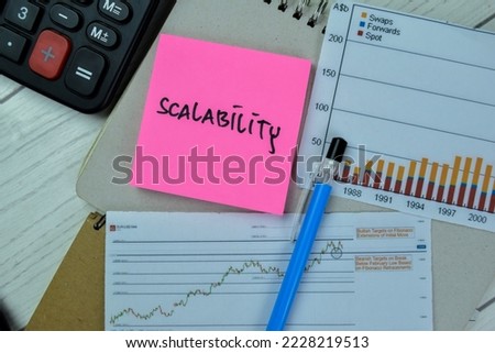 Concept of Scalability write on sticky notes isolated on Wooden Table. Royalty-Free Stock Photo #2228219513