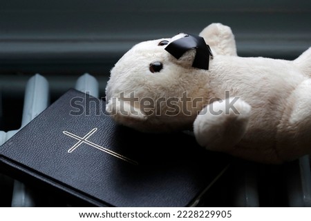 Bear with tape on his mouth. Symbol of silence on child  abuse in the church. Royalty-Free Stock Photo #2228229905