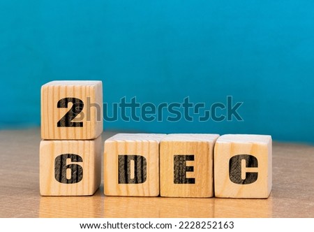 Cube shape calendar for December 26 on wooden surface with empty space for text,cube calendar for december on wood background