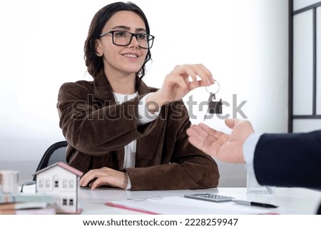 real estate sales woman with key