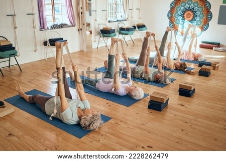 Yoga class, legs stretching band and women training for retirement health, wellness and self care on pilates studio floor. Senior community healthcare, exercise and elderly group of people workout Royalty-Free Stock Photo #2228262479