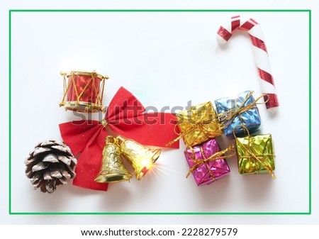 christmas cane,ribbon,crum,present boxes on whote background top view